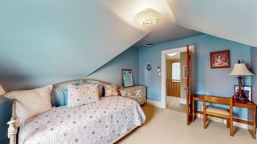 169 84th Street Brooklyn, NY 11209 - Photo 26 of 40 a bedroom with a bed and a table in it