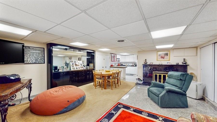 169 84th Street Brooklyn, NY 11209 - Photo 27 of 40 a living room with furniture a flat screen tv and kitchen view
