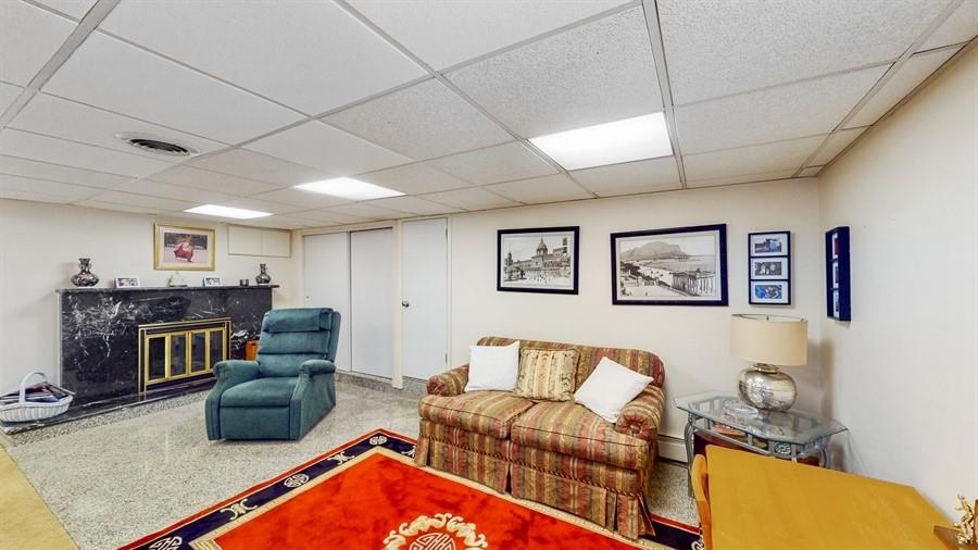 169 84th Street Brooklyn, NY 11209 - Photo 28 of 40 a living room with furniture and a fireplace