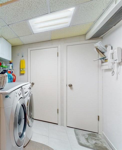 169 84th Street Brooklyn, NY 11209 - Photo 31 of 40 a utility room with dryer and washer