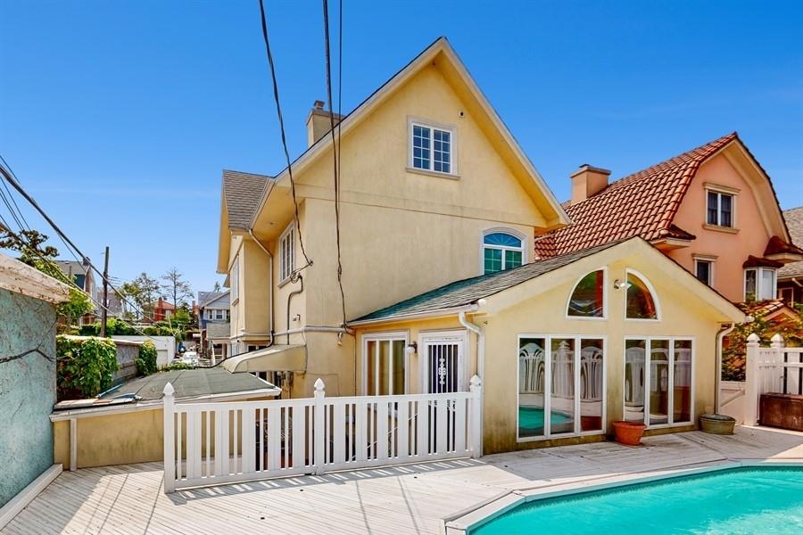 169 84th Street Brooklyn, NY 11209 - Photo 34 of 40 a view of a white house with a yard