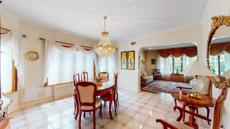 169 84th Street Brooklyn, NY 11209 - Photo 8 of 40 a dining room with furniture a chandelier and wooden floor