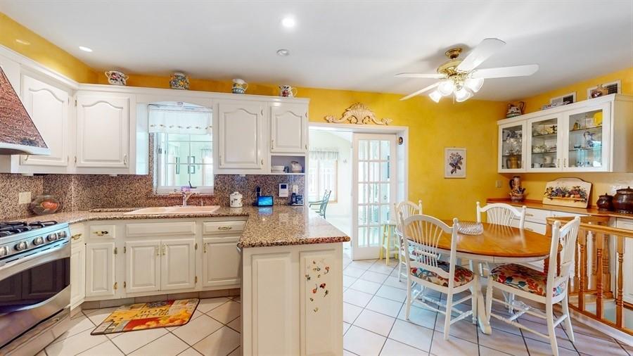 169 84th Street Brooklyn, NY 11209 - Photo 10 of 40 a kitchen with a sink stove and cabinets