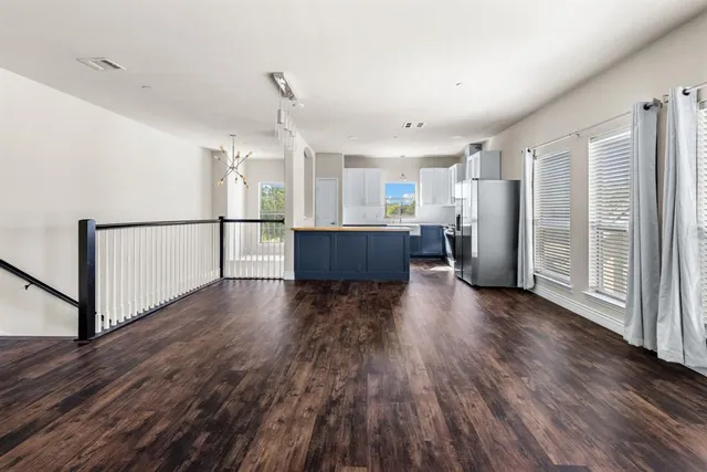 a view of kitchen and wooden floor