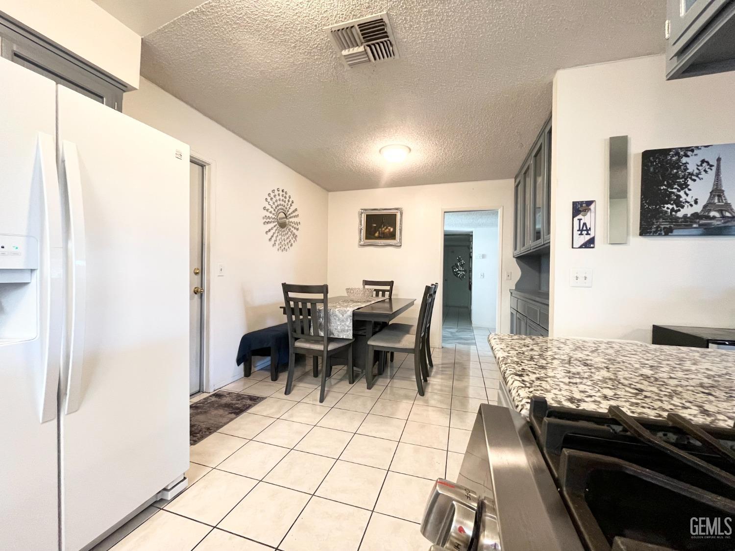 Undisclosed Address Bakersfield, CA 93304 - Photo 16 of 33 a view of a dining area with furniture