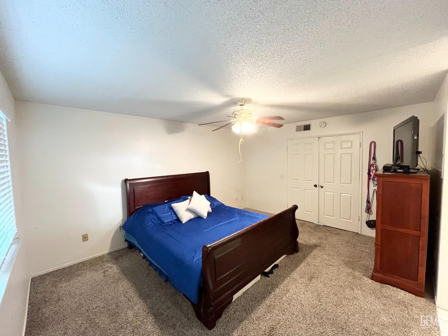 Undisclosed Address Bakersfield, CA 93304 - Photo 19 of 33 a living room with furniture and wooden floor