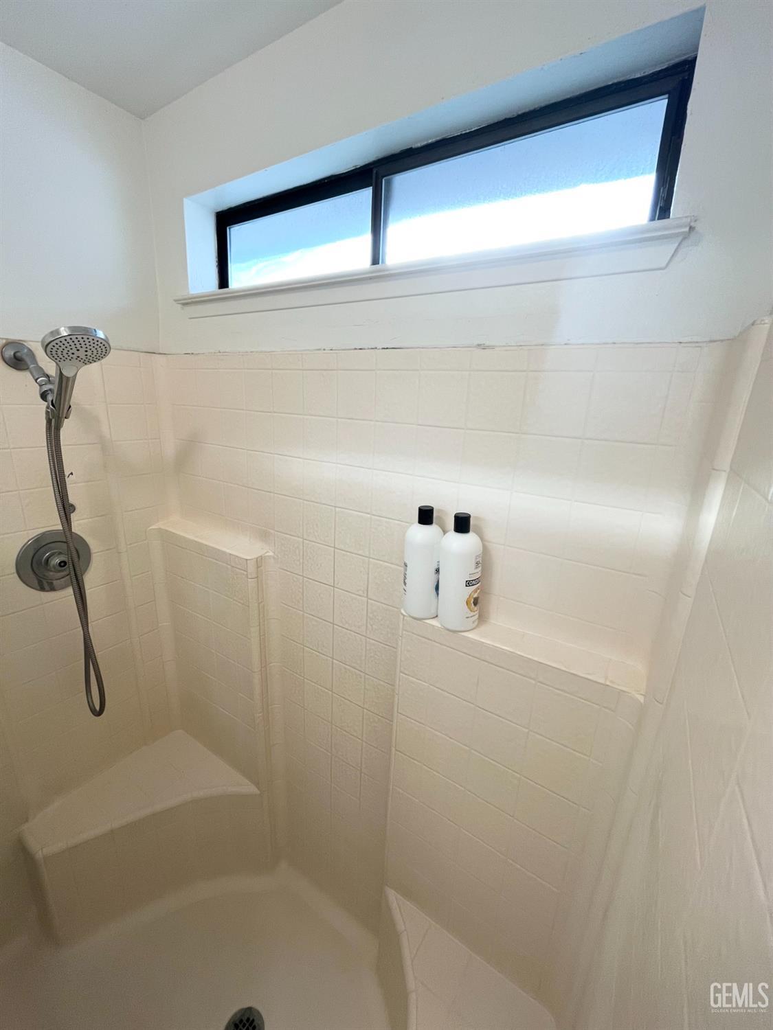 Undisclosed Address Bakersfield, CA 93304 - Photo 22 of 33 a bathroom with a shower
