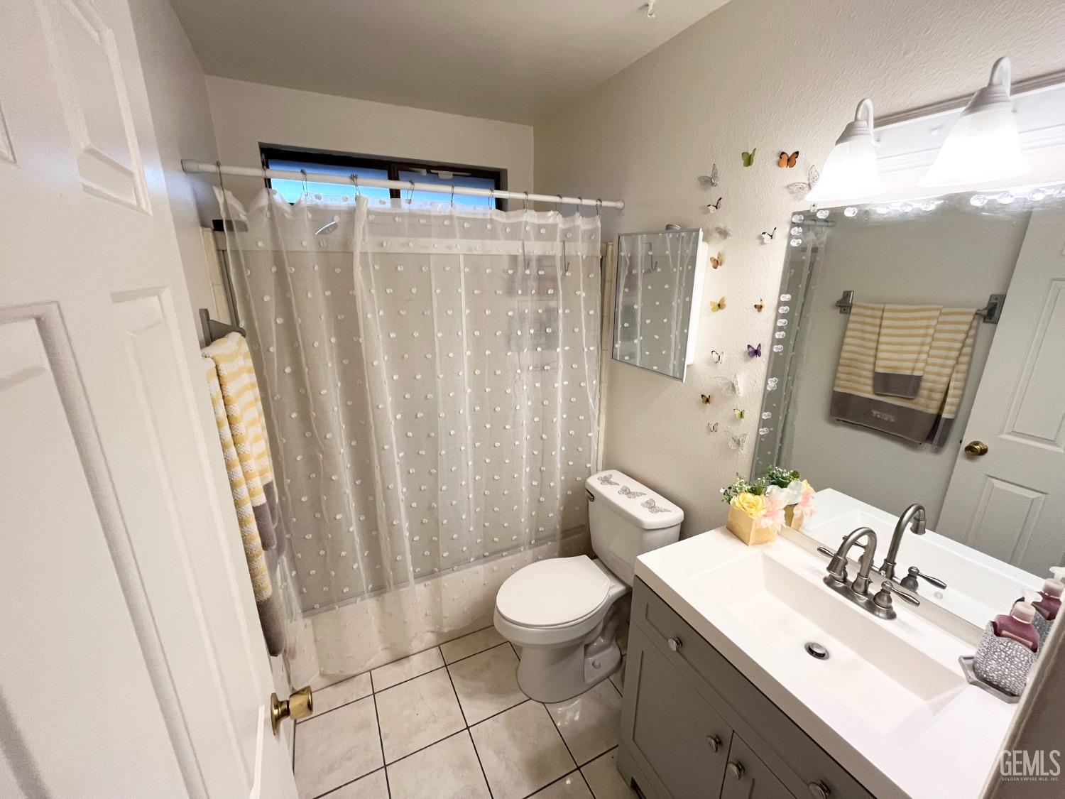 Undisclosed Address Bakersfield, CA 93304 - Photo 25 of 33 a bathroom with a sink toilet and shower