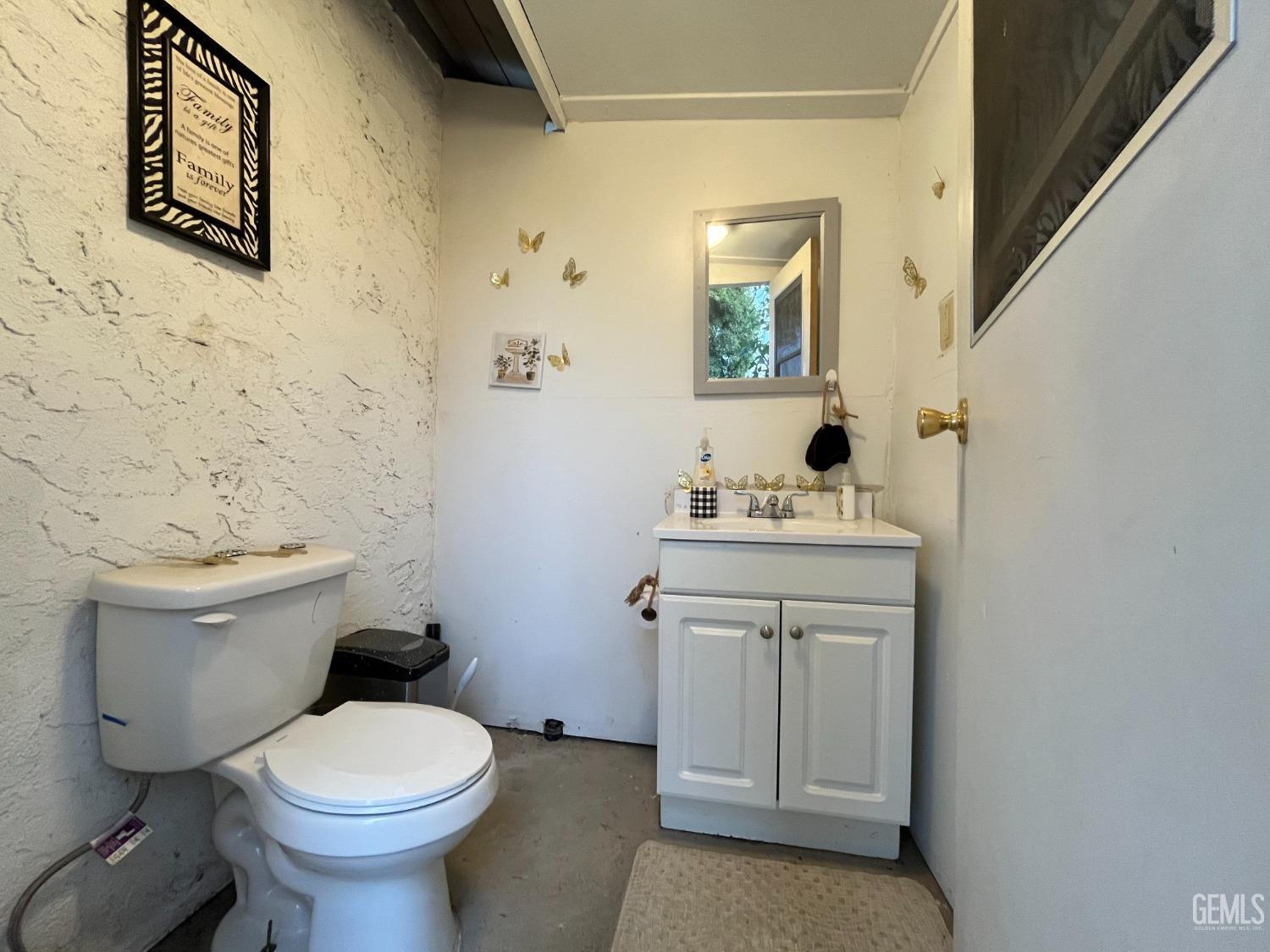 Undisclosed Address Bakersfield, CA 93304 - Photo 28 of 33 a bathroom with a sink toilet and mirror