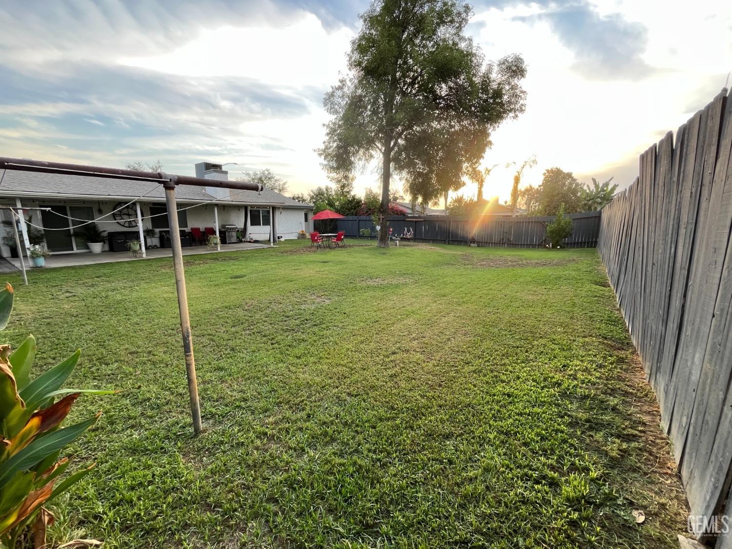 Undisclosed Address Bakersfield, CA 93304 - Photo 29 of 33 a view of a house with backyard