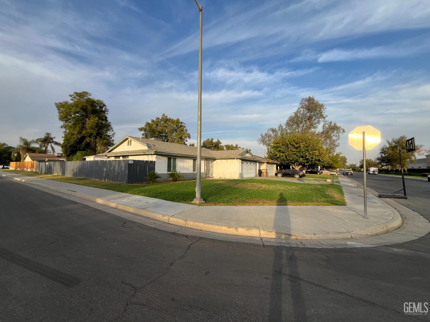 Undisclosed Address Bakersfield, CA 93304 - Photo 3 of 33 a view of a house with a yard