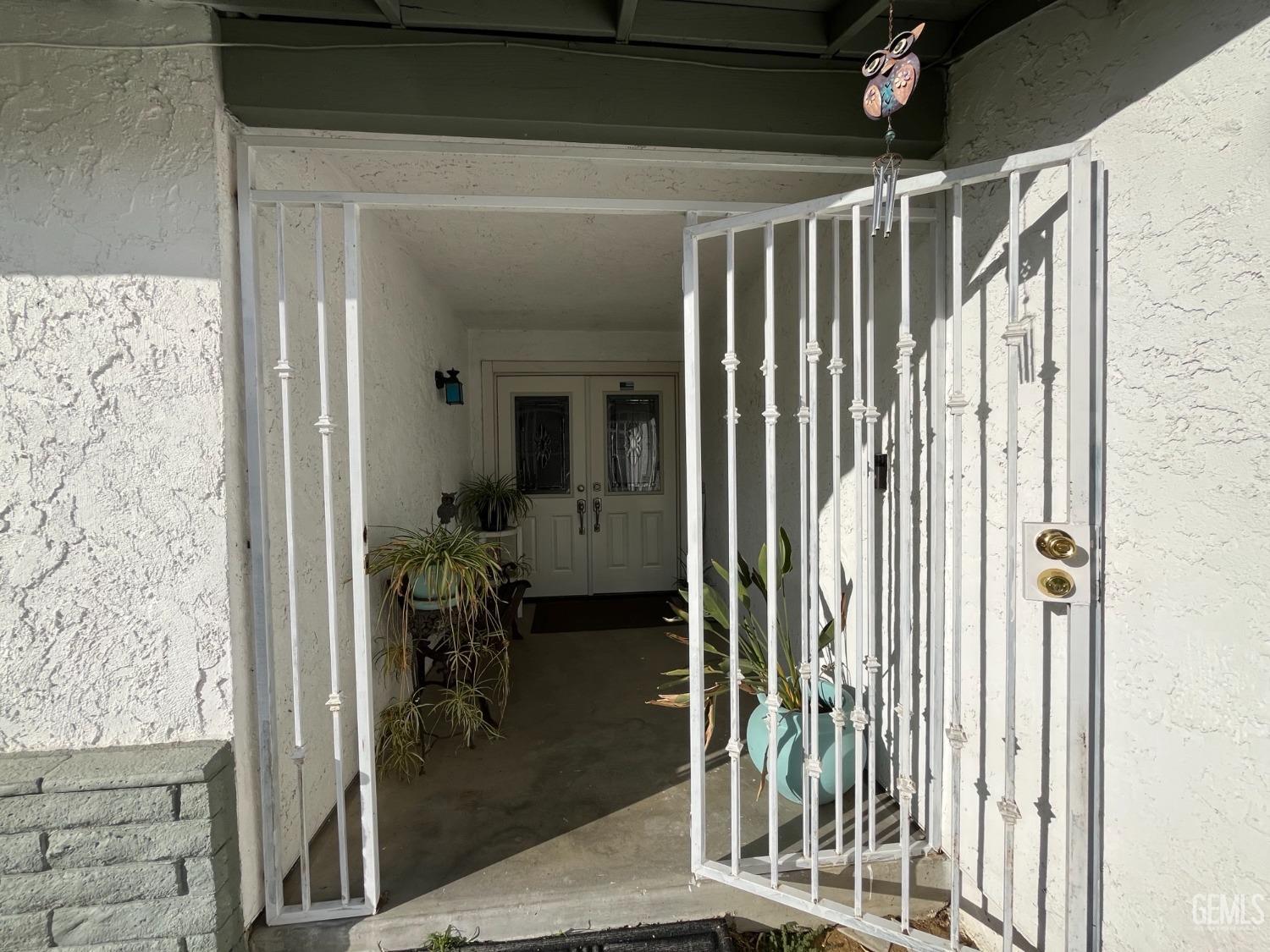 Undisclosed Address Bakersfield, CA 93304 - Photo 4 of 33 a view of a porch with dining table and chairs