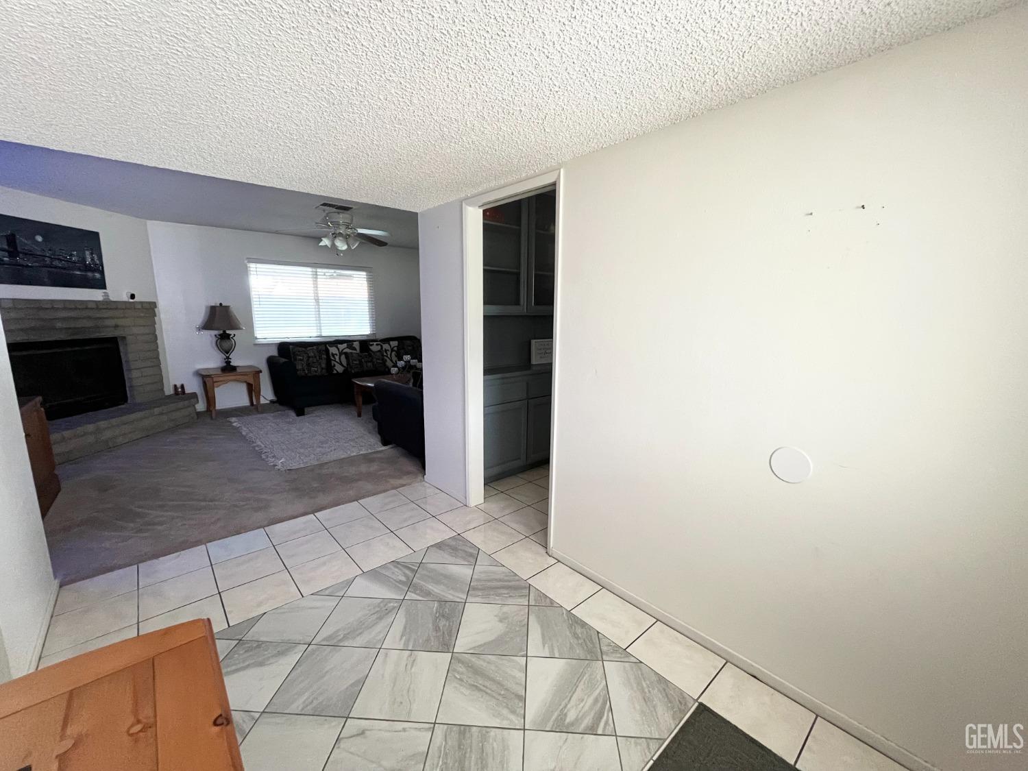 Undisclosed Address Bakersfield, CA 93304 - Photo 7 of 33 a view of a livingroom with furniture and an empty room