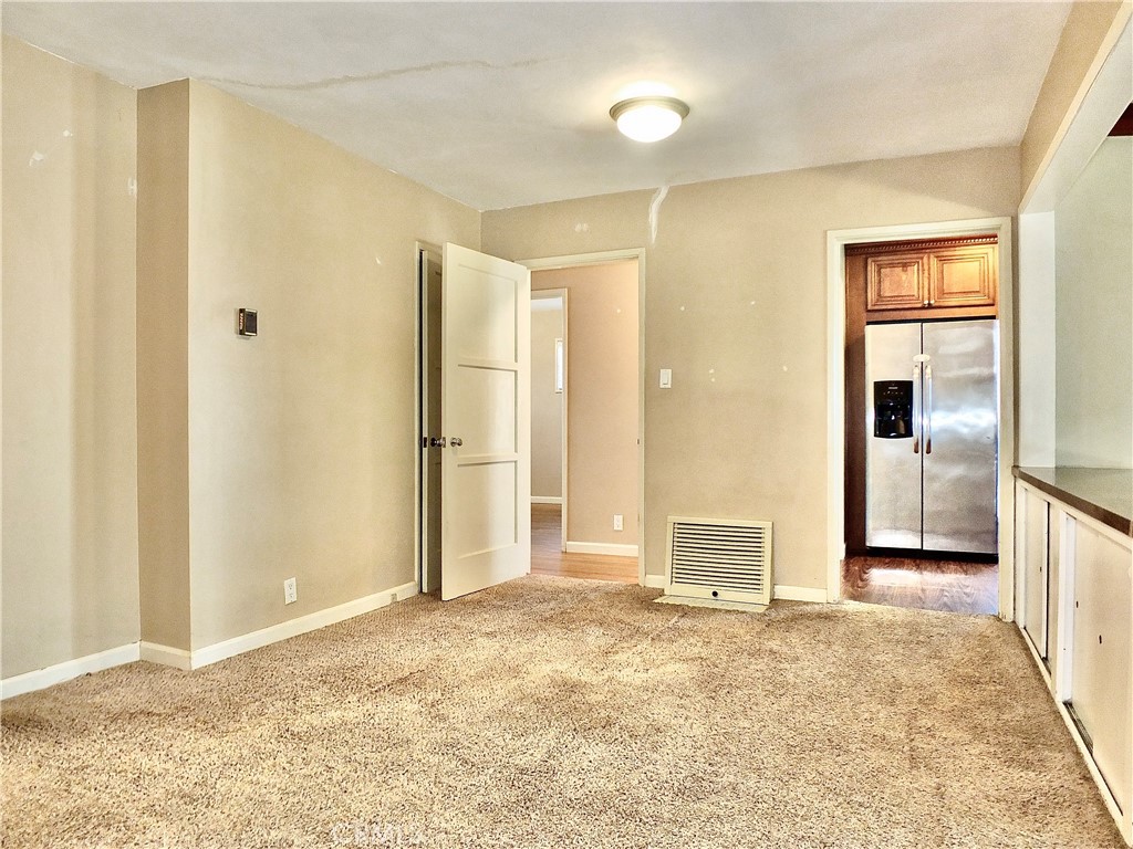 2024 San Anseline Avenue Long Beach, CA 90815 - Photo 15 of 36 a view of a big room with windows and refrigerator