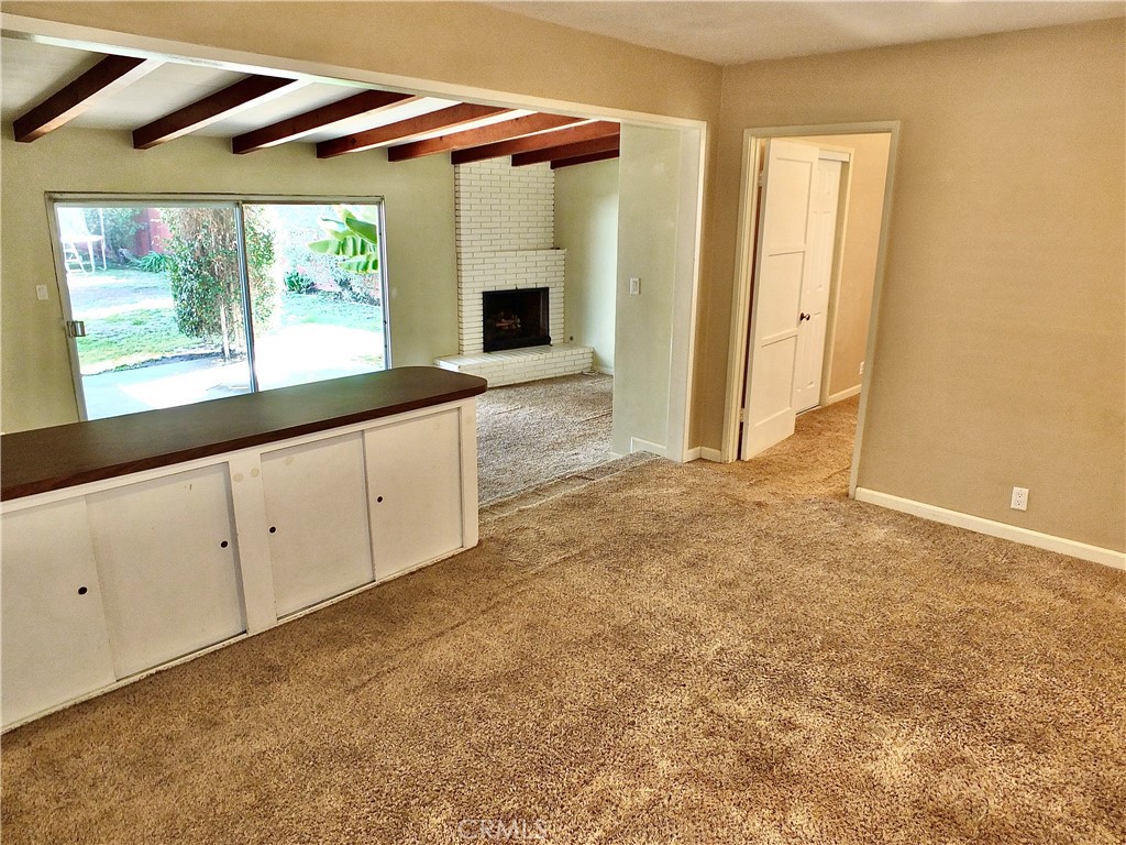 2024 San Anseline Avenue Long Beach, CA 90815 - Photo 17 of 36 a view of an empty room with window and cabinet
