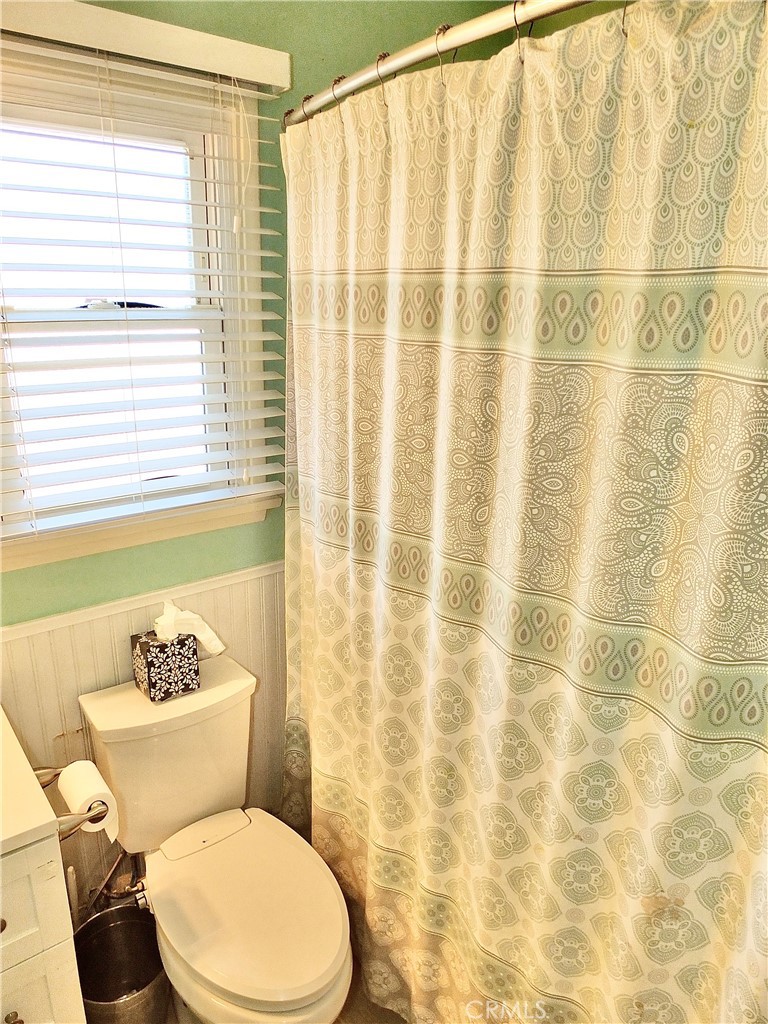 2024 San Anseline Avenue Long Beach, CA 90815 - Photo 27 of 36 a white toilet sitting next to a bathroom sink