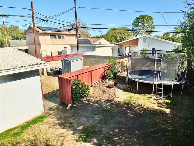 a view of a backyard with sitting area