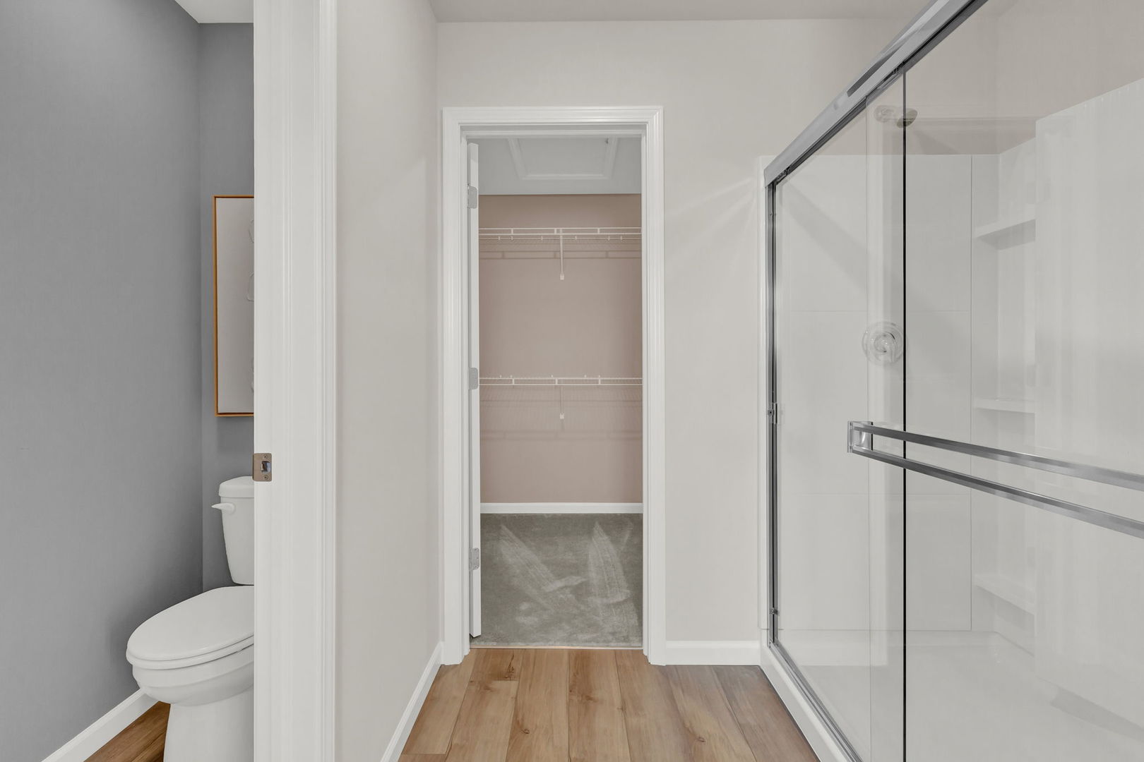 5913 Hawkweed Drive, Unit 8704 Plainfield, IL 60585 - Photo 15 of 17 a bathroom with a shower and a toilet