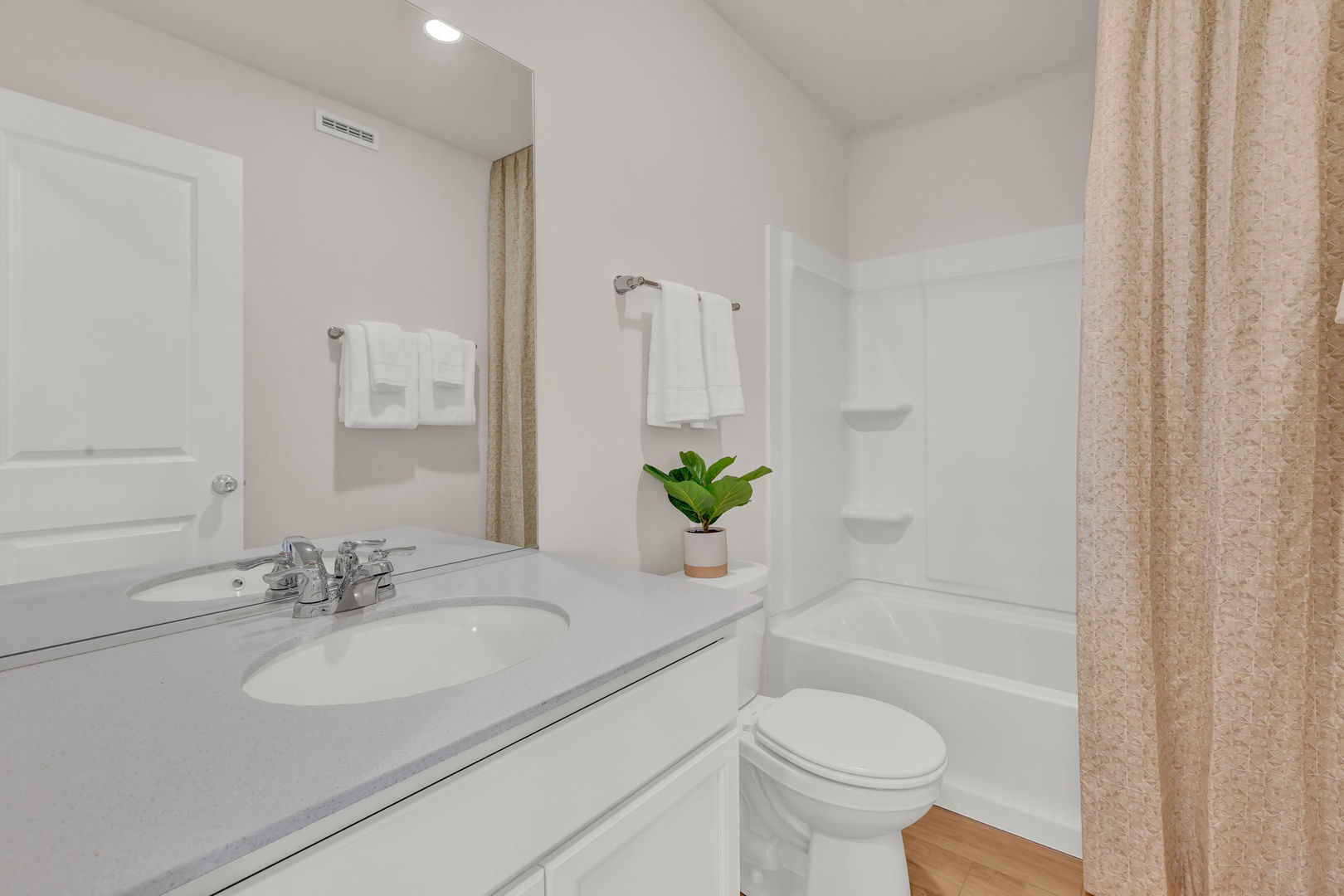 5913 Hawkweed Drive, Unit 8704 Plainfield, IL 60585 - Photo 16 of 17 a bathroom with a sink toilet and a mirror