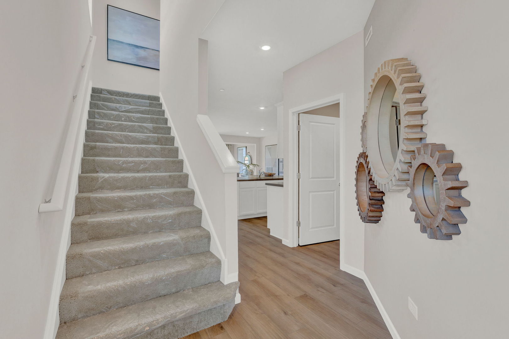 5913 Hawkweed Drive, Unit 8704 Plainfield, IL 60585 - Photo 4 of 17 a view of entryway and hall with wooden floor