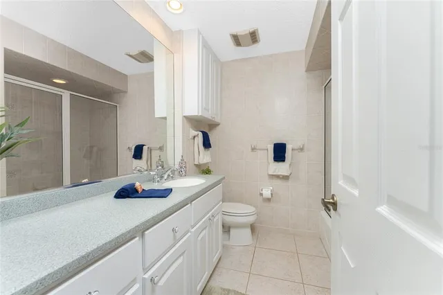 a view of house with swimming pool outdoor seating area