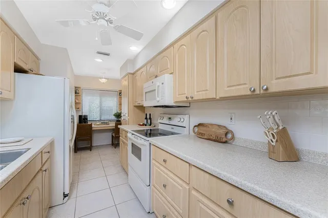 a kitchen with stainless steel appliances granite countertop a sink and cabinets