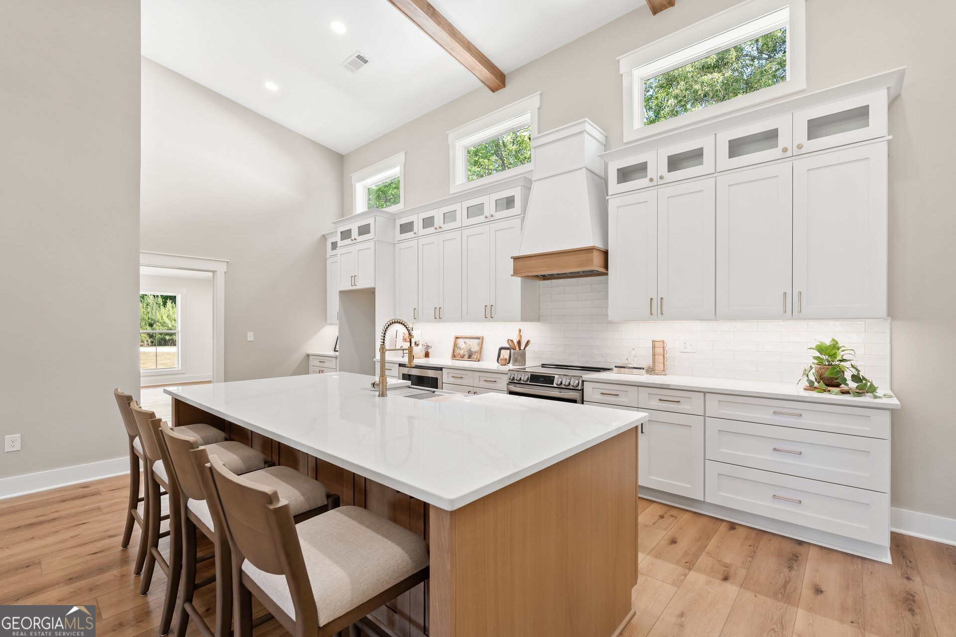 5938 Ridgeway Road Franklin, GA 30217 - Photo 11 of 41 a kitchen with a table chairs stove and cabinets