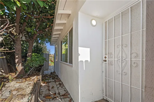a bathroom with a sink and glass door