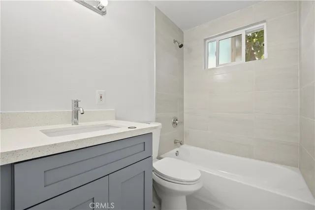 a bathroom with a sink toilet and bathtub