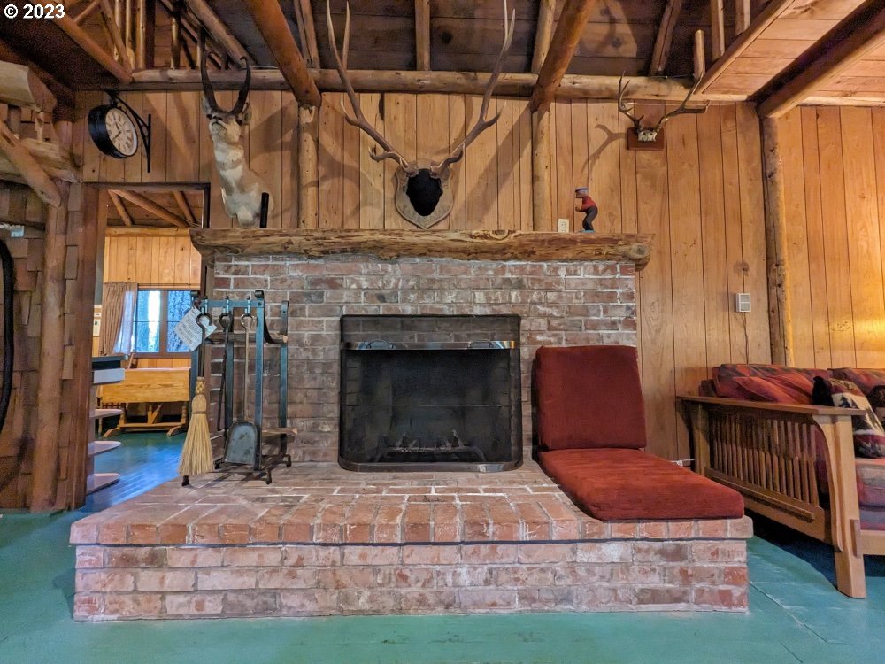 79128 Road 35 A Rhododendron, OR 97049 - Photo 11 of 36 a living room with furniture and a fireplace