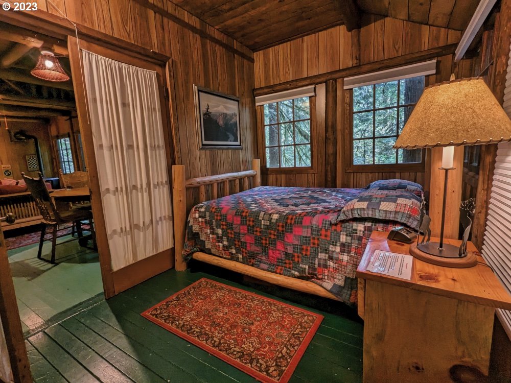 79128 Road 35 A Rhododendron, OR 97049 - Photo 21 of 36 a bed room with a bed and a window