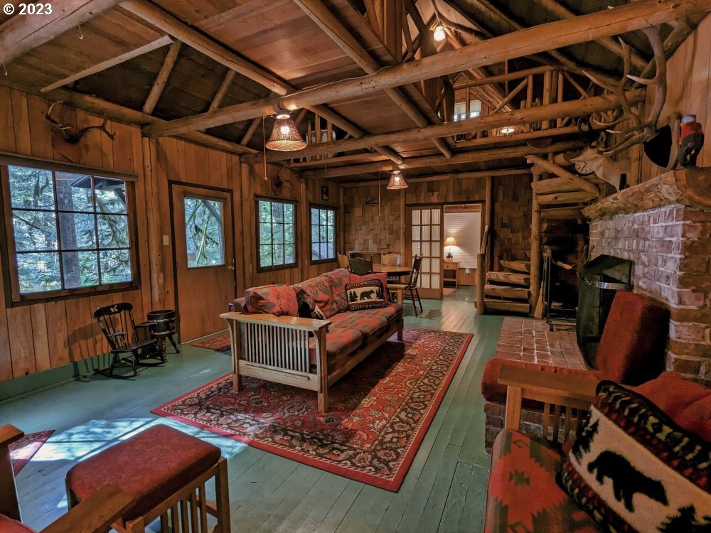 79128 Road 35 A Rhododendron, OR 97049 - Photo 5 of 36 a living room with furniture a rug and a table