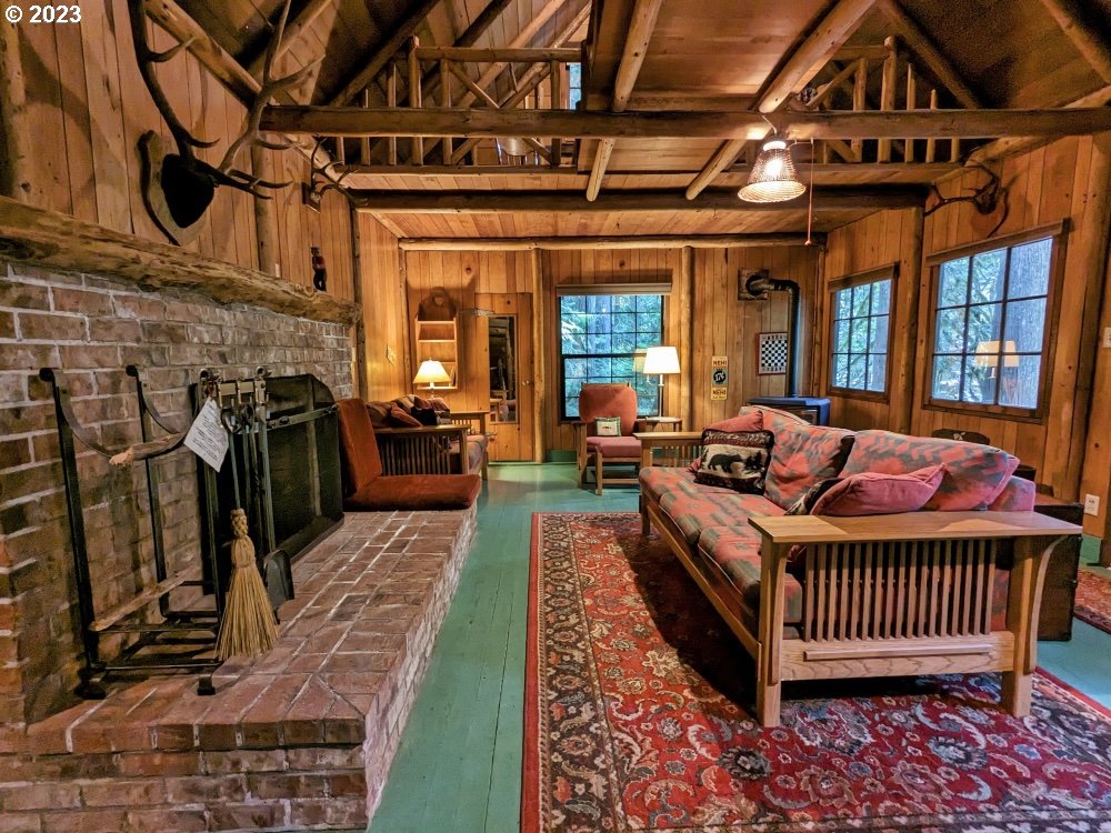 79128 Road 35 A Rhododendron, OR 97049 - Photo 6 of 36 a living room with furniture and a fireplace