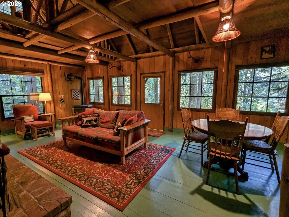 79128 Road 35 A Rhododendron, OR 97049 - Photo 8 of 36 a living room with furniture and a dining table
