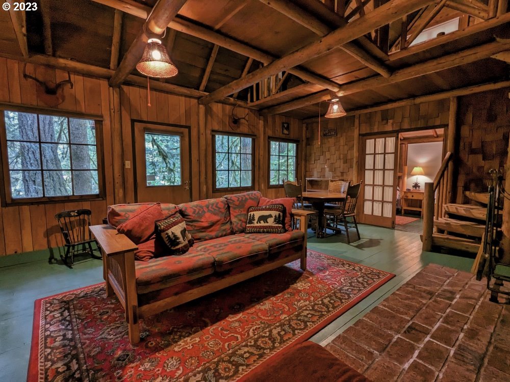 79128 Road 35 A Rhododendron, OR 97049 - Photo 10 of 36 a living room with furniture a ceiling fan and a rug