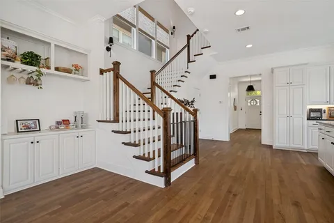 a view of entryway with wooden floor and stairs