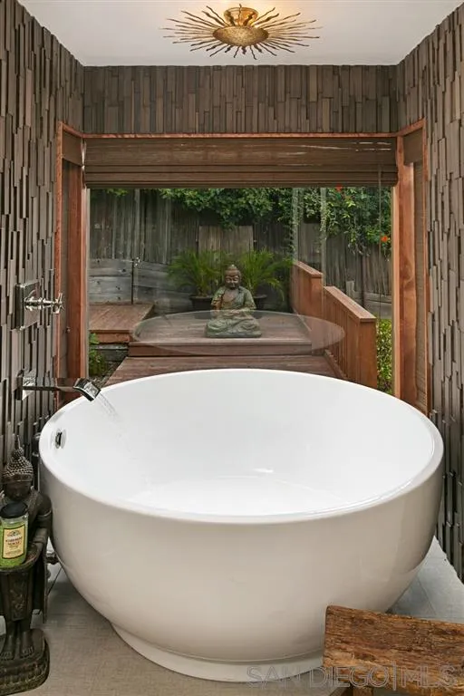 1106 Muirlands Drive La Jolla, CA 92037 - Photo 13 of 24 a white bath tub sitting in a bathroom