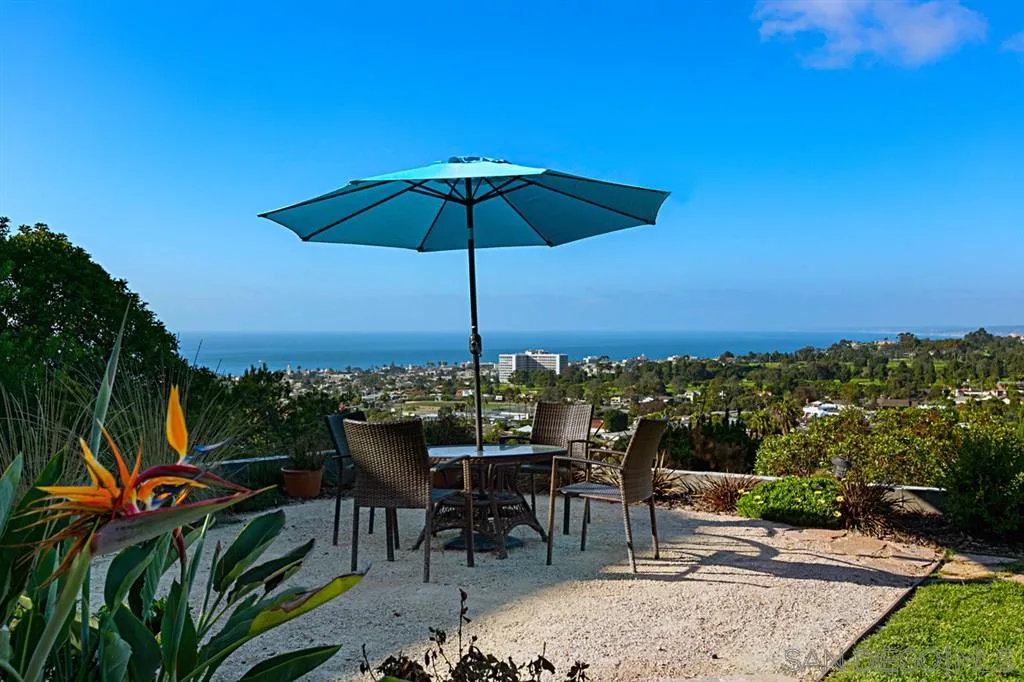1106 Muirlands Drive La Jolla, CA 92037 - Photo 19 of 24 a view of a tables and chairs under an umbrella