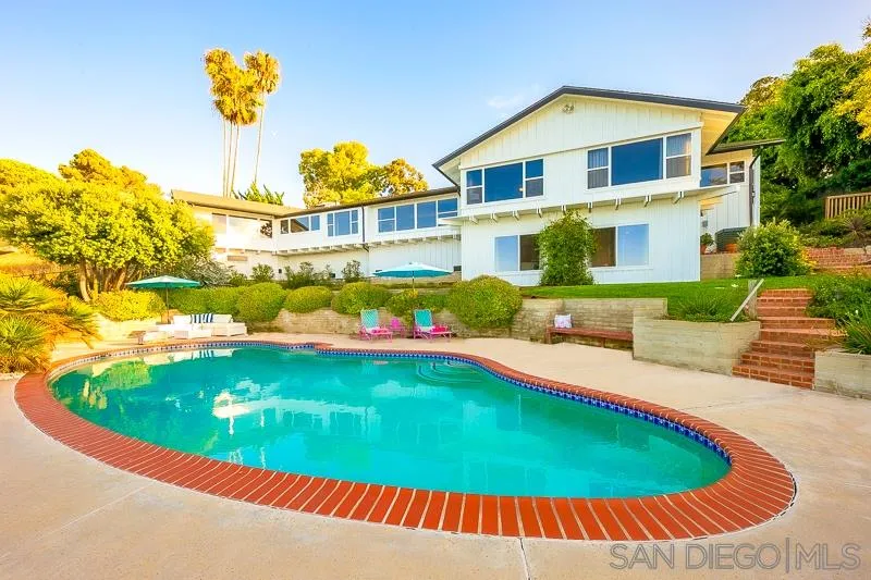 1106 Muirlands Drive La Jolla, CA 92037 - Photo 2 of 24 a view of a swimming pool with a patio