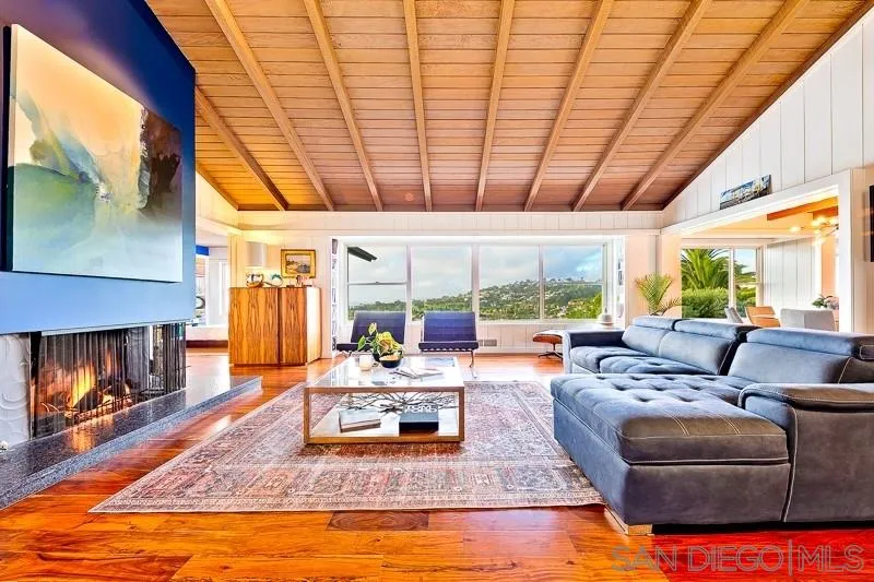 1106 Muirlands Drive La Jolla, CA 92037 - Photo 3 of 24 a living room with furniture and a fireplace