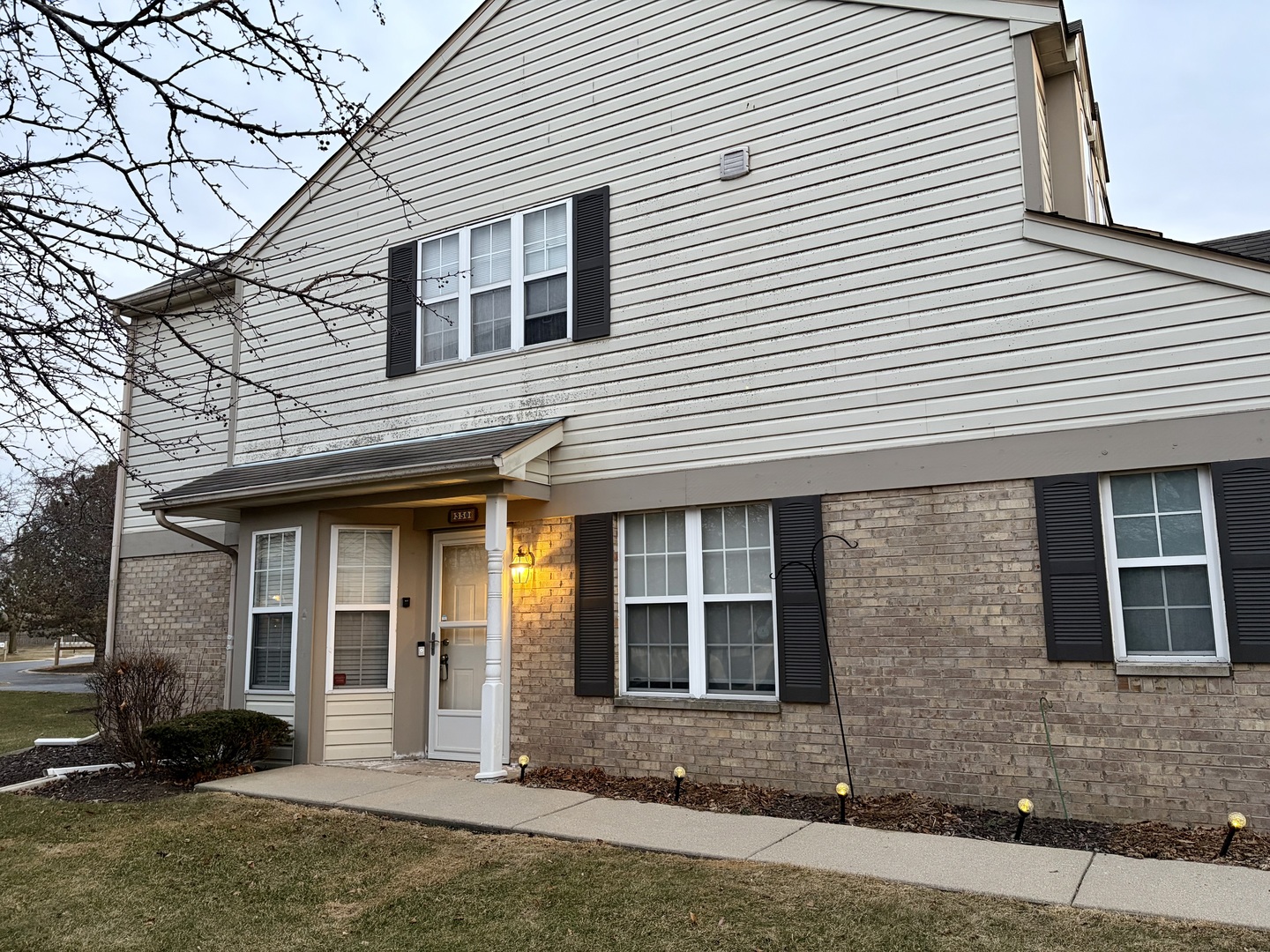 a front view of a house with a yard