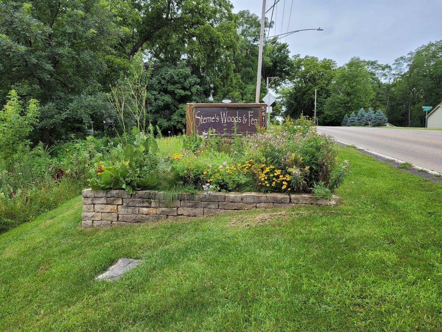 350 Crystal Ridge Drive, Unit 350 Crystal Lake, IL 60012 - Photo 16 of 18 a view of a garden with a bench