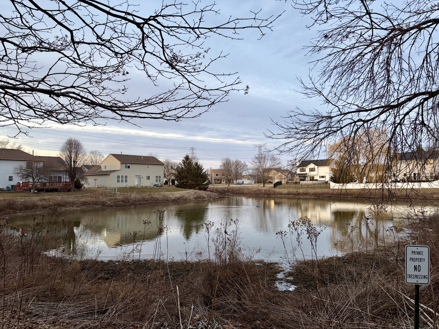 350 Crystal Ridge Drive, Unit 350 Crystal Lake, IL 60012 - Photo 5 of 18 a view of a lake with houses in the back