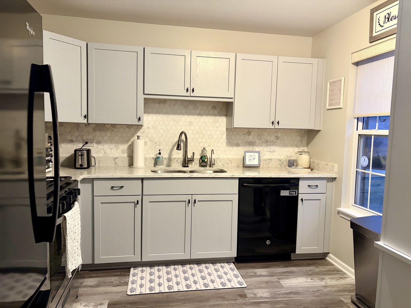 350 Crystal Ridge Drive, Unit 350 Crystal Lake, IL 60012 - Photo 8 of 18 a kitchen with stainless steel appliances granite countertop a refrigerator sink and white cabinets