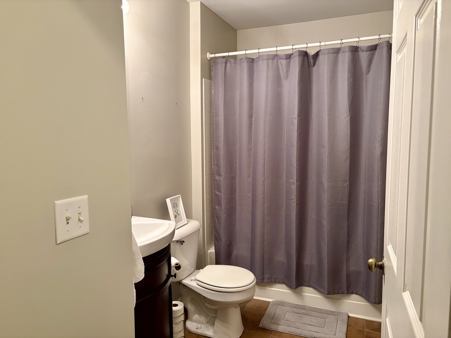 350 Crystal Ridge Drive, Unit 350 Crystal Lake, IL 60012 - Photo 10 of 18 a white toilet sitting next to a shower curtain