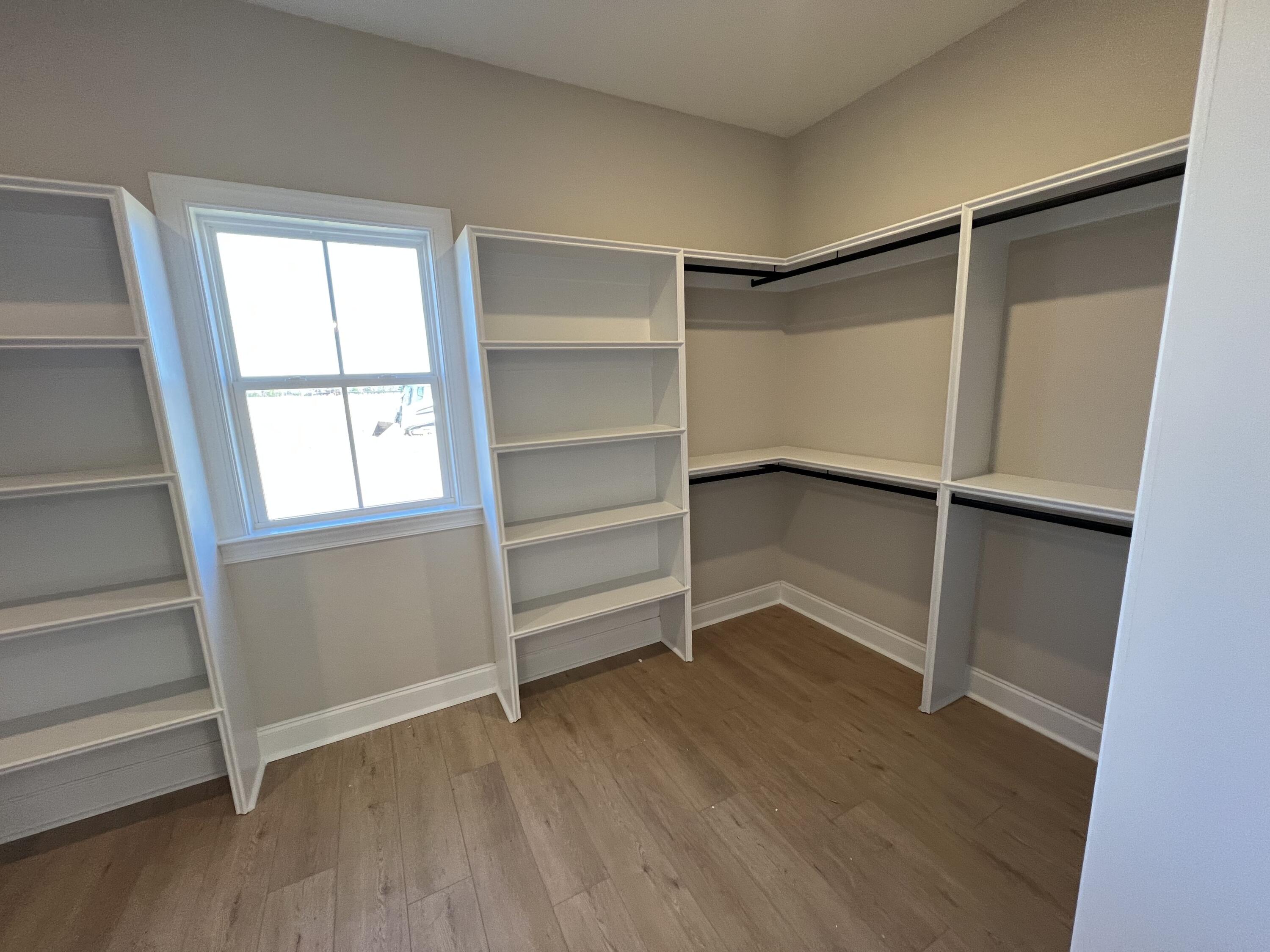 2747 Storm Branch Road Beech Island, SC 29842 - Photo 19 of 38 a view of an empty room with a window and wooden floor