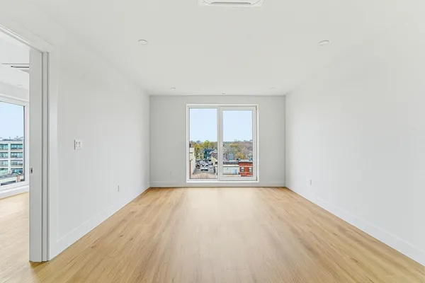 an empty room with large window