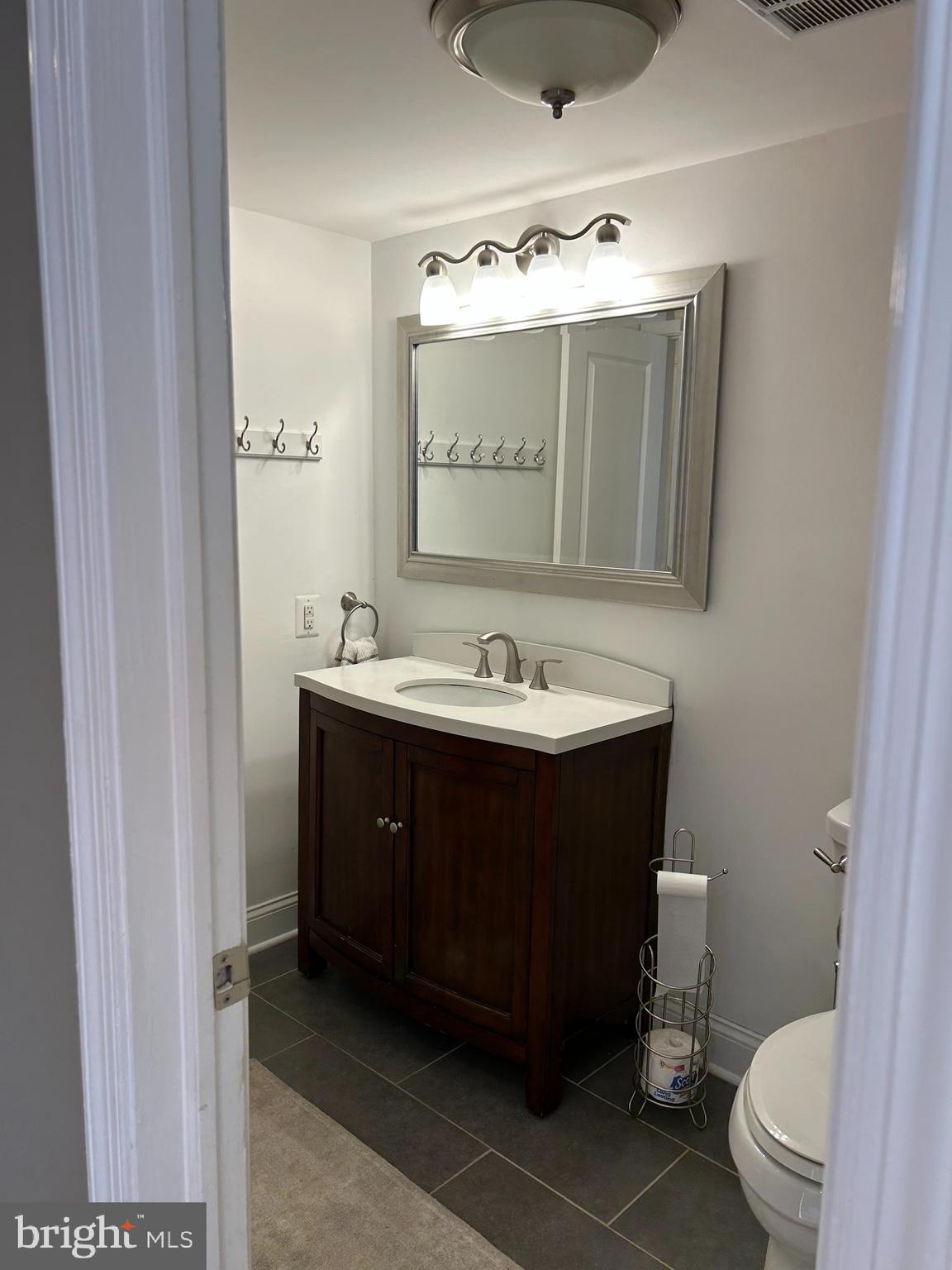 2-3 Aspen Way Doylestown, PA 18901 - Photo 12 of 18 a bathroom with a sink vanity and a toilet