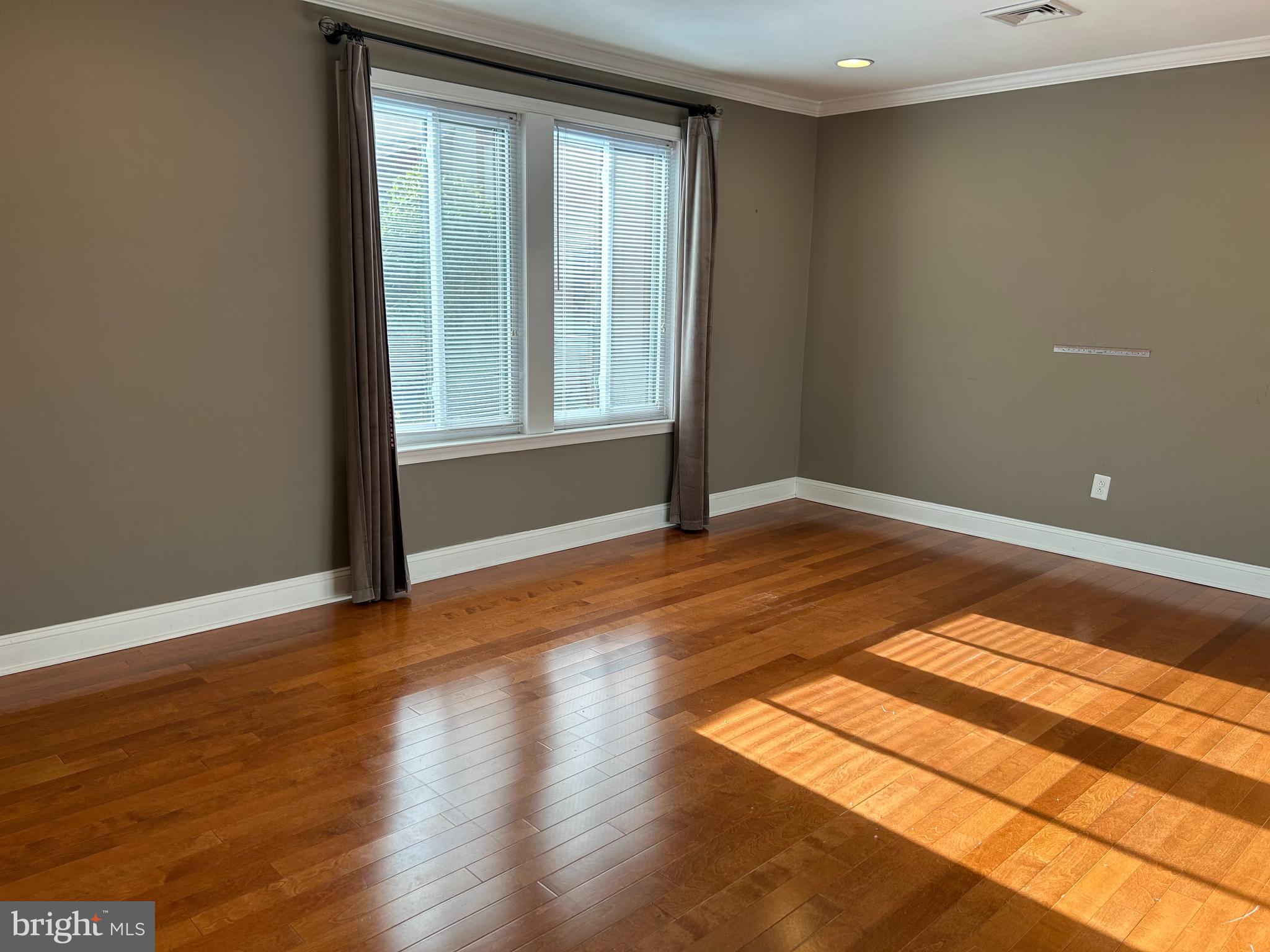2-3 Aspen Way Doylestown, PA 18901 - Photo 14 of 18 a view of an empty room with wooden floor and a window