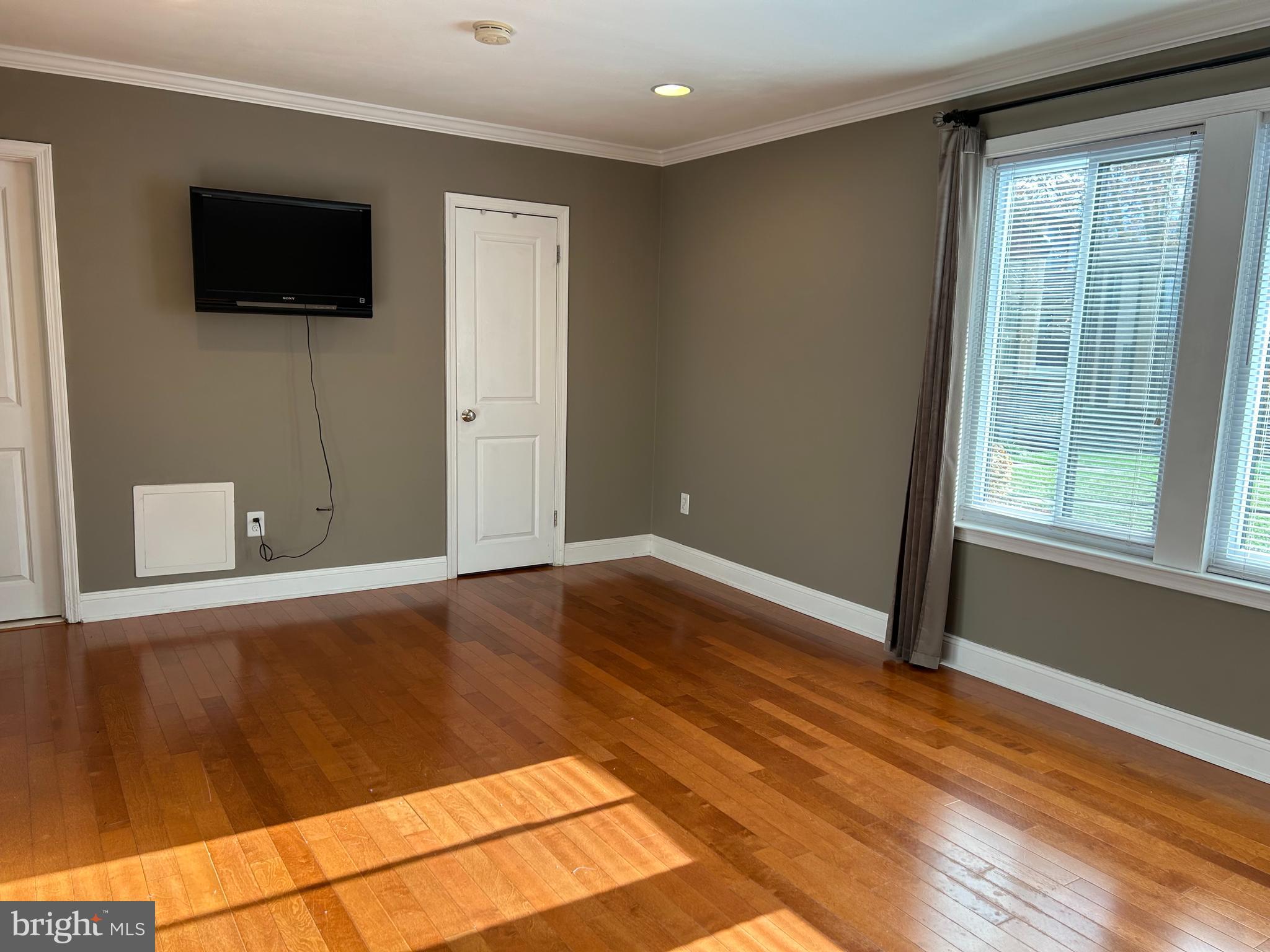 2-3 Aspen Way Doylestown, PA 18901 - Photo 15 of 18 a view of a livingroom with wooden floor and a flat screen tv